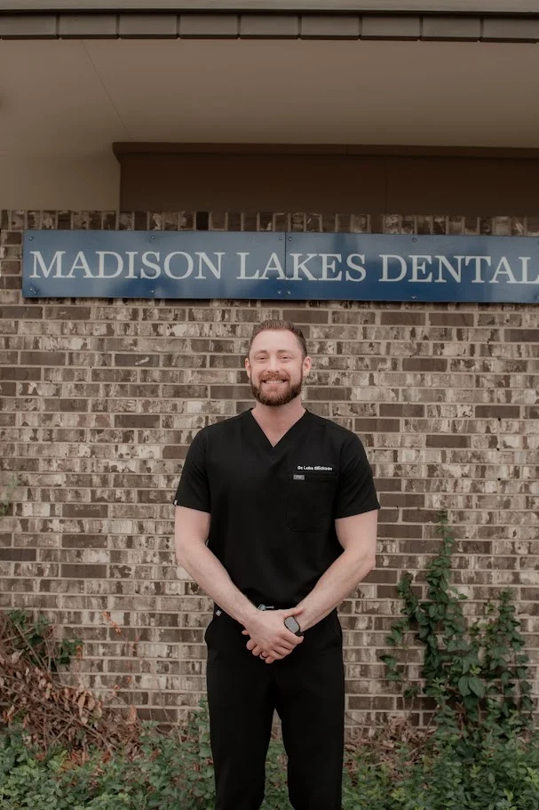 Dr. Luke Ellickson, DDS, standing outside Madison Lakes Dental